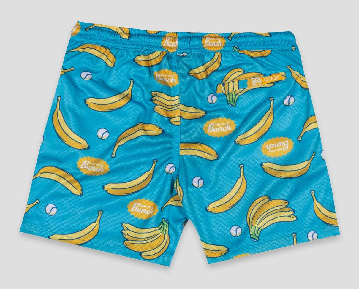 Blue swim shorts with banana pattern on a light gray background