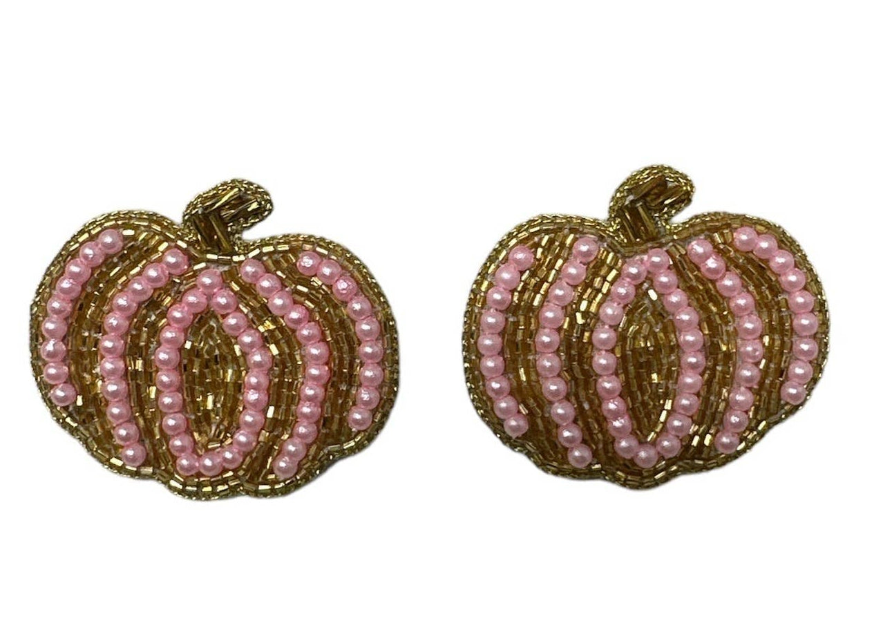 A pair of pumpkin-shaped stud earrings made of pink faux pearls and gold wire, shown on a plain white background.
