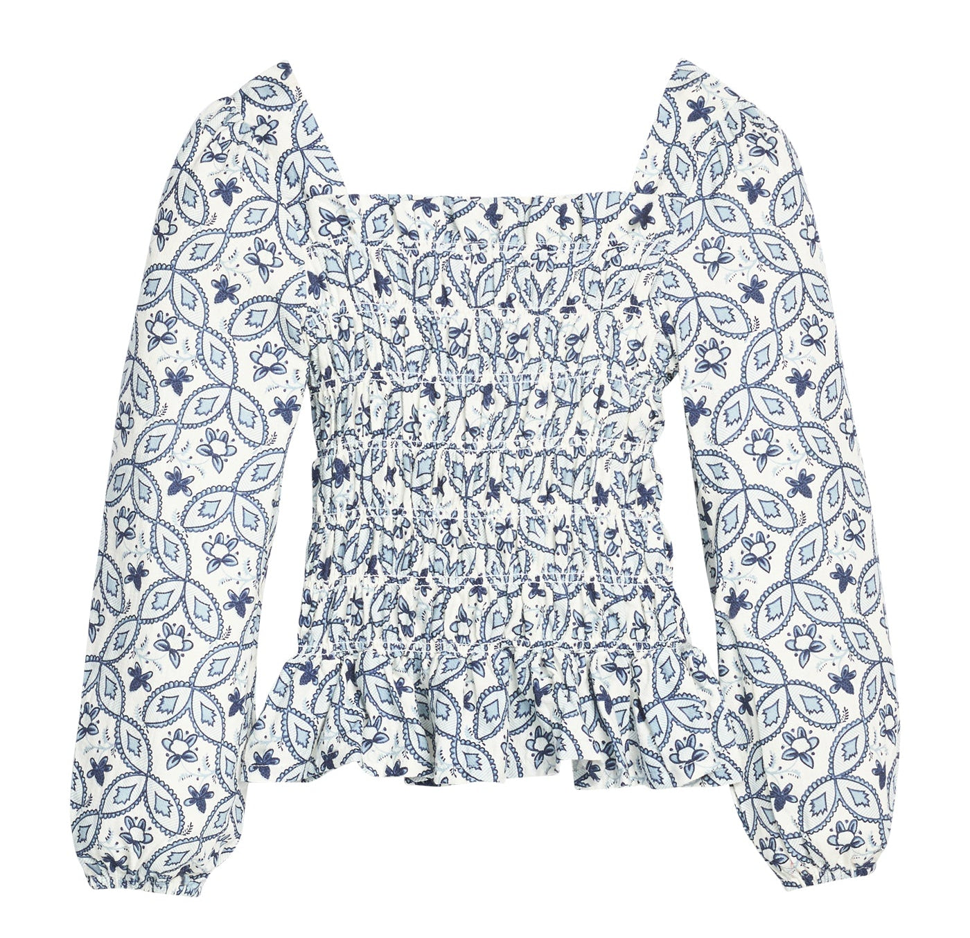 A long-sleeve smocked blouse with a blue and white floral and geometric pattern, featuring a square neckline and a ruffled peplum hem.