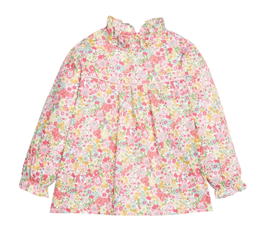 A long-sleeve blouse with a high ruffled collar and an all-over dense floral print in pink, yellow, green, and white, displayed flat against a solid white background.